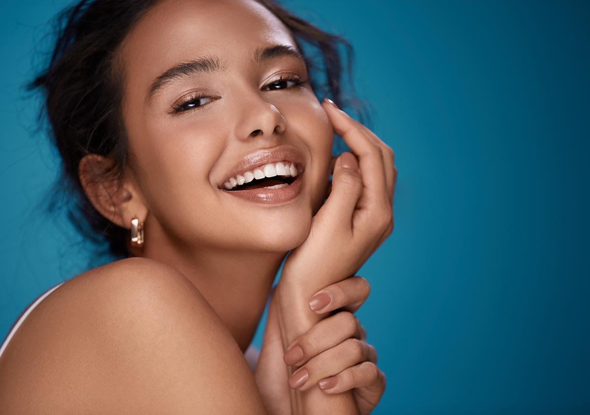 African american woman smiling in a blue background