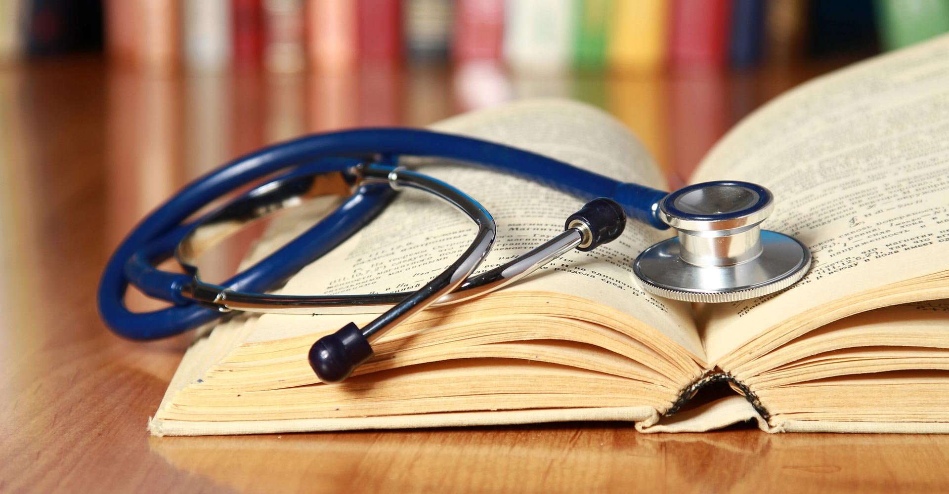 A stethoscope is lying with a book