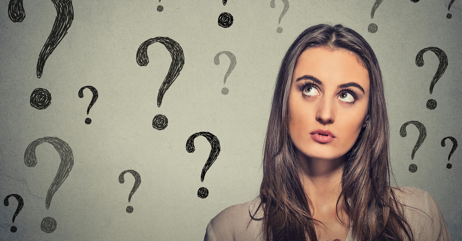 Beautiful woman thinking looking up has many questions