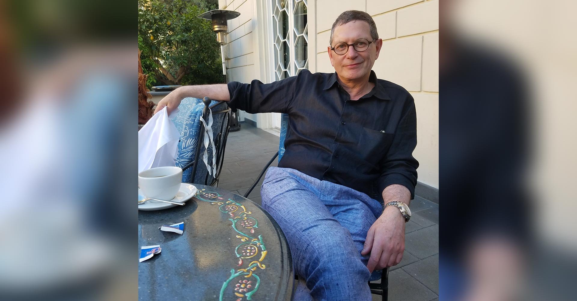 Dr. Kirwan sitting on a chair