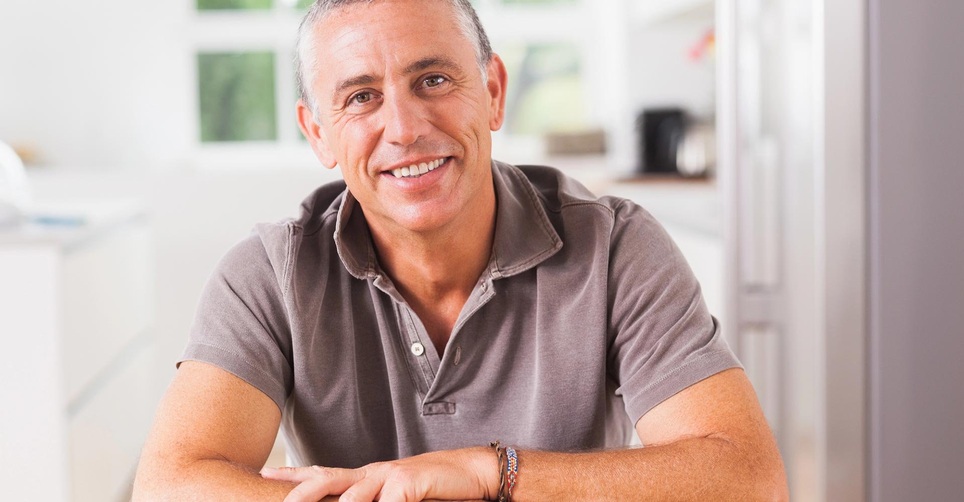 Happy man in kitchen