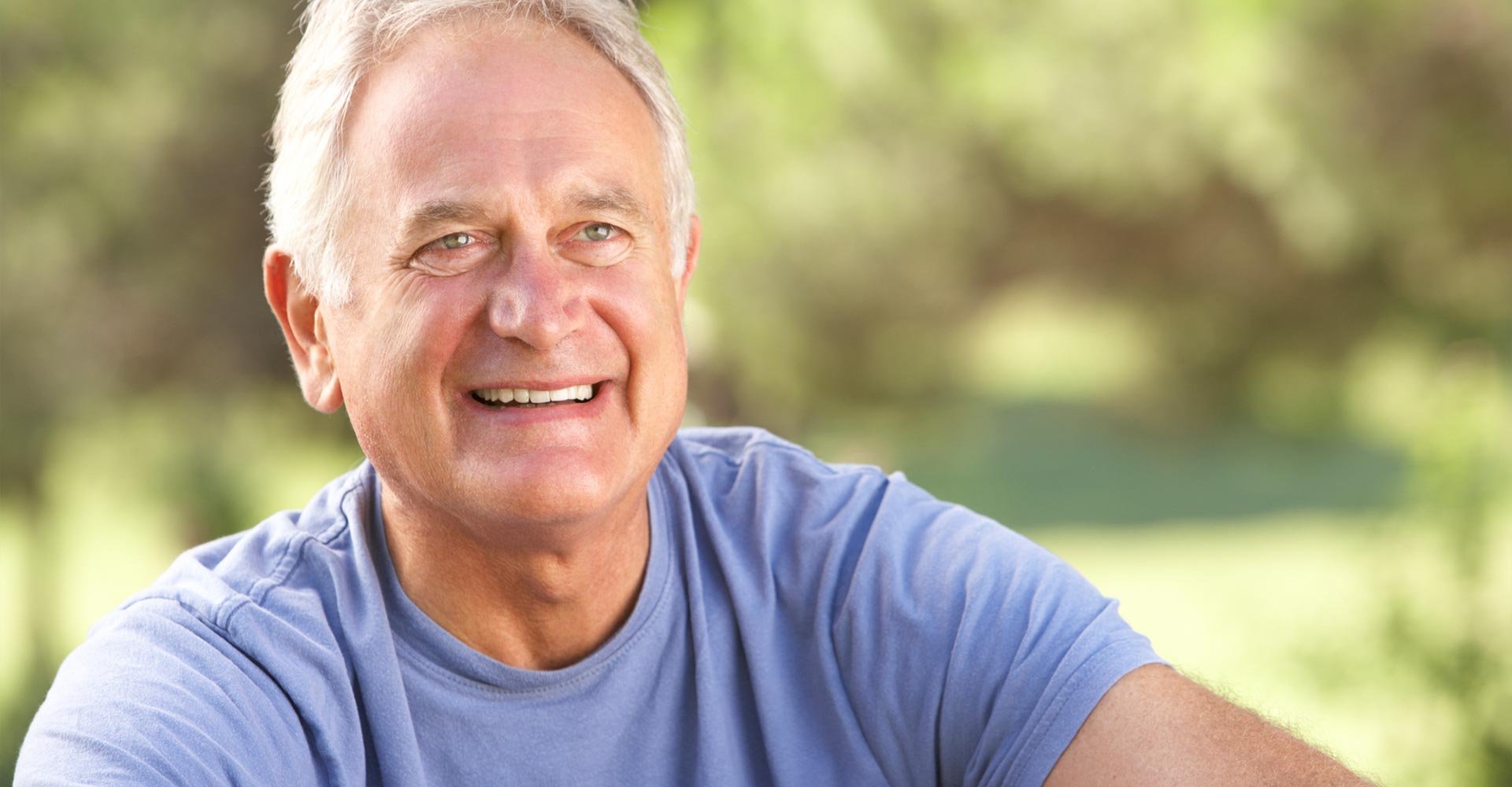 Senior Man Relaxing In Countryside