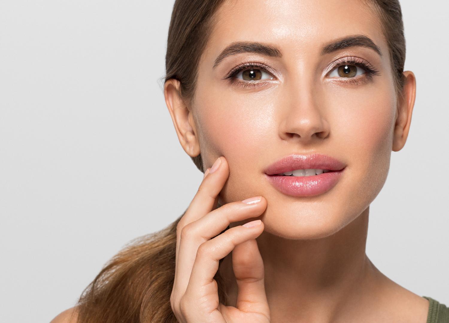 Beauty portrait of a woman touching her cheek
