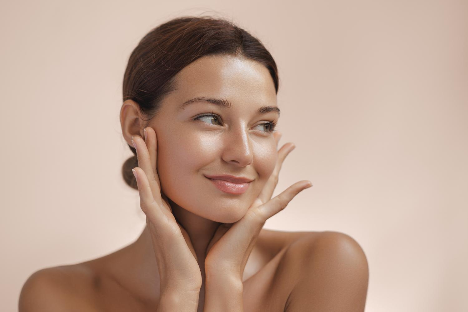 Woman framing her face, showcasing plastic surgery results in Fairfield, CT